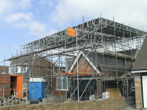 Temporary roofing scaffolding erected to a bungalow near Knott End-on-Sea, Lancashire